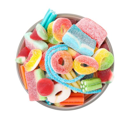 Bowl of tasty colorful jelly candies on white background, top view