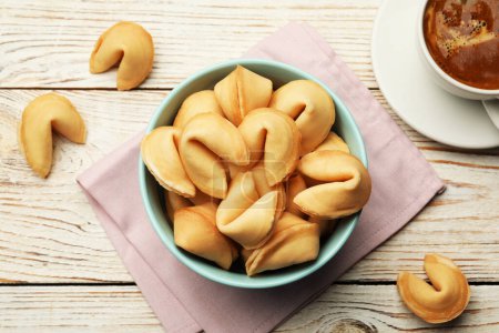 Photo for Tasty fortune cookies with predictions on white wooden table, flat lay - Royalty Free Image