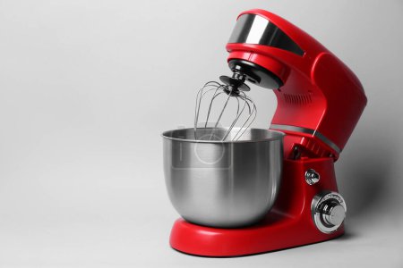 Photo for Modern red stand mixer on light grey background, space for text - Royalty Free Image