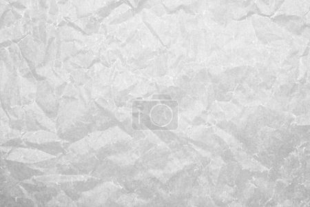 Téléchargez les photos : Texture de papier de cuisson blanc froissé comme fond, vue du dessus - en image libre de droit