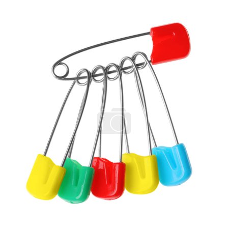 New colorful safety pins on white background