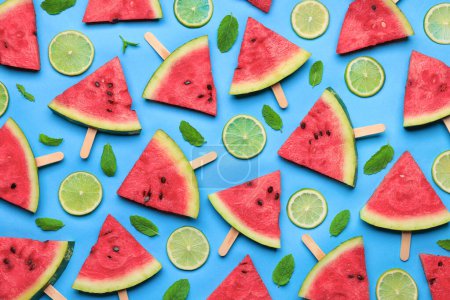 Photo for Tasty sliced watermelon and limes on light blue background, flat lay - Royalty Free Image
