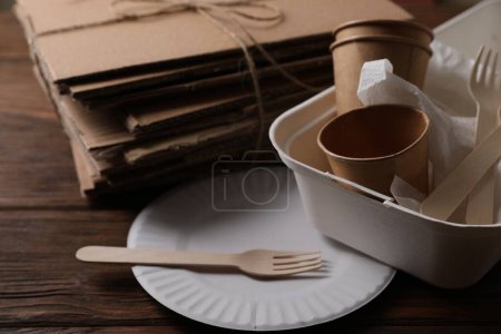 Photo for Heap of waste paper on wooden table, closeup - Royalty Free Image
