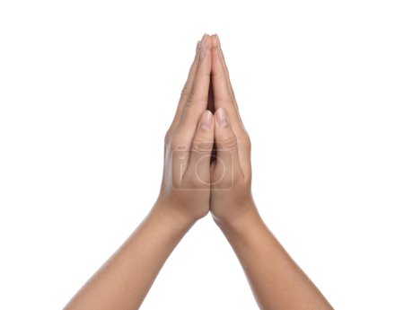 Woman holding hands clasped while praying on white background, closeup