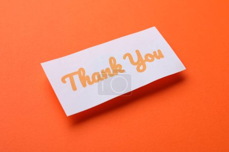 Photo for Note with phrase Thank You on orange background - Royalty Free Image