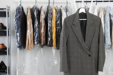 Photo for Dark business suit at dry-cleaner's. Space for text - Royalty Free Image