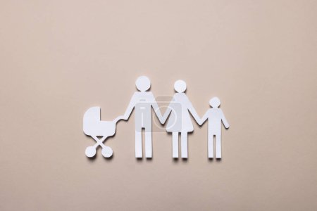 Photo for Paper family figures on beige background, top view. Insurance concept - Royalty Free Image