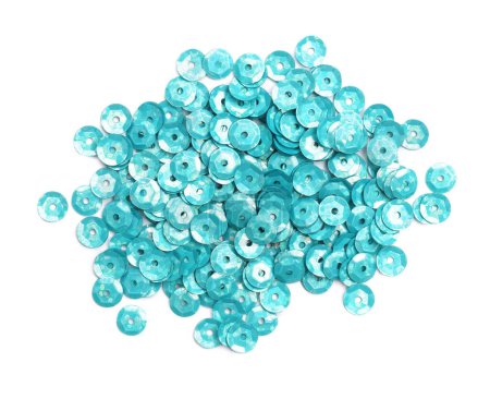 Pile of turquoise sequins on white background, top view
