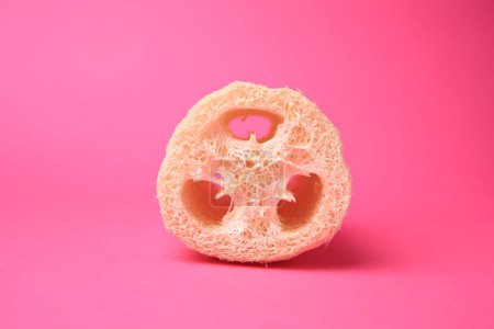 Photo for Natural loofah sponge on pink background. Personal hygiene - Royalty Free Image