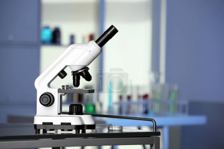Photo for Modern medical microscope on metal table in laboratory, space for text - Royalty Free Image
