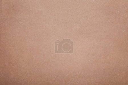Téléchargez les photos : Texture de papier de cuisson brun comme fond, vue de dessus - en image libre de droit
