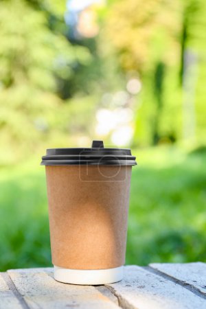 Photo for Paper cup on street outdoors. Takeaway drink - Royalty Free Image
