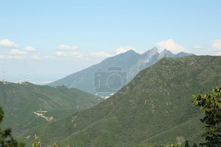 Photo for Picturesque view of mountains and trees under cloudy sky - Royalty Free Image