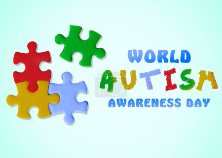 Photo for World Autism Awareness Day. Colorful puzzle pieces and text on light blue background, top view - Royalty Free Image