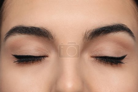 Foto de Young woman with permanent eyeliner makeup, closeup - Imagen libre de derechos