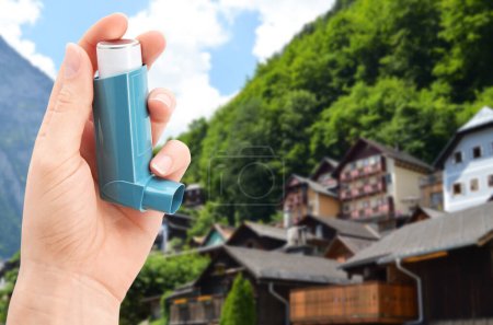 Photo for Woman with asthma inhaler in mountains, closeup. Emergency first aid during outdoor recreation - Royalty Free Image