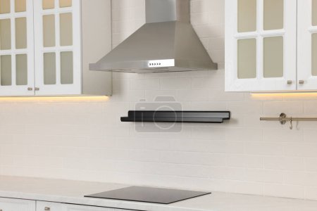 Photo for Modern range hood and furniture in kitchen - Royalty Free Image