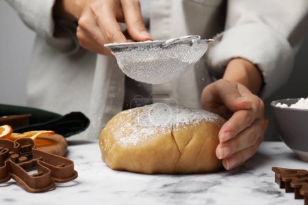 Photo for Woman flouring dough for cookies at white marble table, closeup - Royalty Free Image