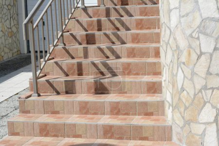 Photo for Beautiful tiled stairs with metal railings outdoors - Royalty Free Image
