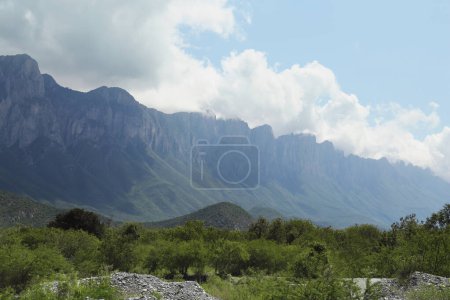 Photo for Picturesque view of beautiful mountain and trees under cloudy sky - Royalty Free Image