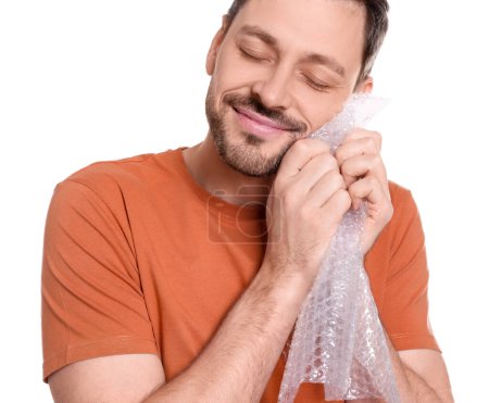Photo for Man popping bubble wrap on white background, closeup. Stress relief - Royalty Free Image
