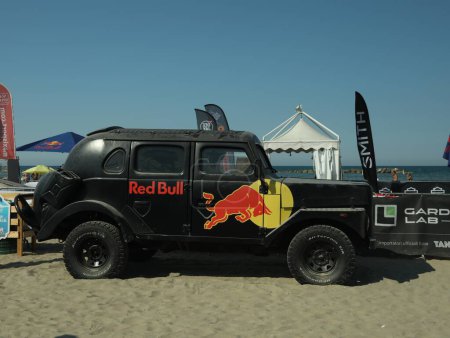 Photo for SENIGALLIA, ITALY - JULY 22, 2022: Red Bull Jeep on beach. Car presentation - Royalty Free Image