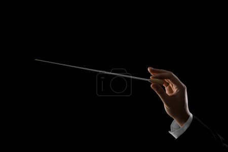 Photo for Professional conductor with baton on black background, closeup - Royalty Free Image