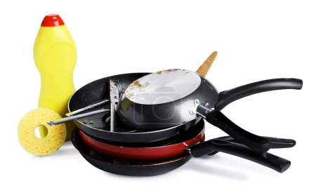 Foto de Montón de utensilios de cocina sucios, detergente para platos y esponja sobre fondo blanco - Imagen libre de derechos