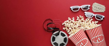 Flat lay composition with delicious popcorn, cinema tickets and glasses on red background, space for text. Banner design