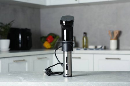 Photo for Thermal immersion circulator on table in kitchen. Sous vide cooking - Royalty Free Image