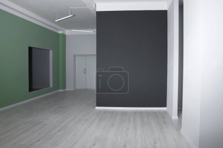 Photo for Empty renovated room with color walls and door - Royalty Free Image