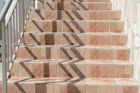 Photo for Beautiful tiled stairs with metal railings outdoors - Royalty Free Image