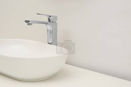 Photo for White washbasin in bathroom, space for text. Interior design - Royalty Free Image