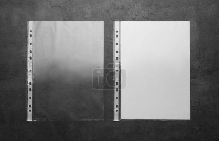 Foto de Punched pockets on light grey table, flat lay - Imagen libre de derechos