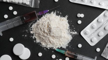 Photo for Many different hard drugs on black background, flat lay - Royalty Free Image