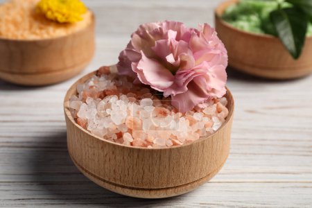 Photo for Different types of aromatic sea salt on white wooden table, closeup - Royalty Free Image