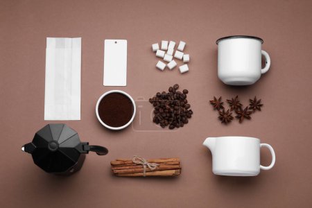 Foto de Flat lay composition with geyser coffee maker and roasted beans on brown background - Imagen libre de derechos