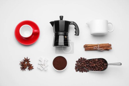 Foto de Flat lay composition with geyser coffee maker and roasted beans on white background - Imagen libre de derechos