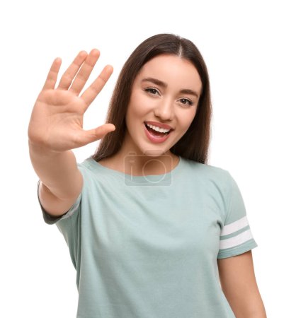Photo for Happy woman giving high five on white background - Royalty Free Image