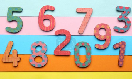 Photo for Wooden numbers on colorful background, flat lay - Royalty Free Image