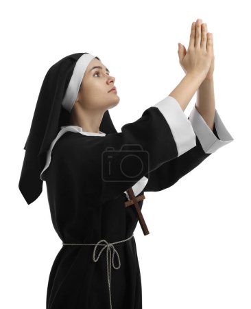 Téléchargez les photos : Nun with clasped hands praying to God on white background - en image libre de droit