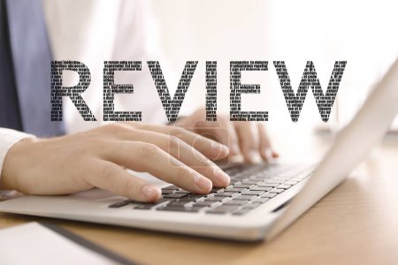 Online review. Man using laptop to leave feedback, closeup
