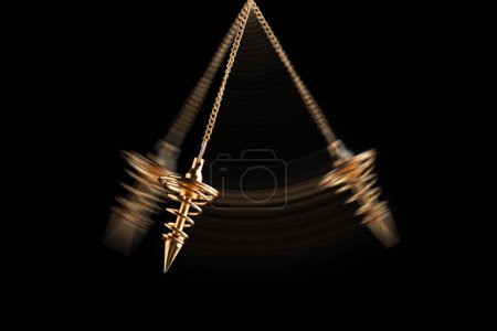 Photo for Hypnosis session. Pendant swinging on black background, motion effect - Royalty Free Image