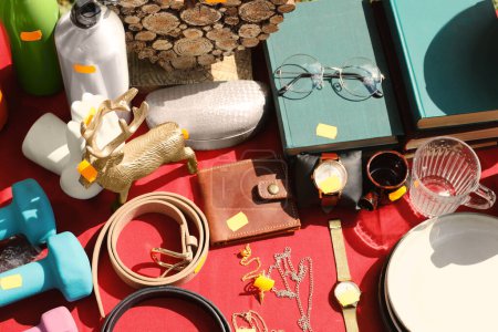 Téléchargez les photos : Many different items on table outdoors, above view. Garage sale - en image libre de droit