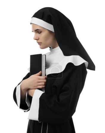 Téléchargez les photos : Young nun holding Bible on white background - en image libre de droit