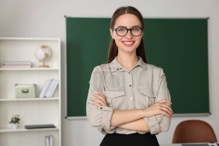 Photo for Portrait of beautiful young teacher in classroom - Royalty Free Image