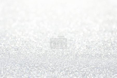 Shiny white glitter as background, closeup view