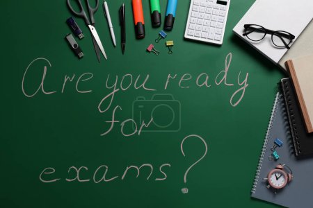 Photo for Green chalkboard with phrase Are You Ready For Exams and different stationery, flat lay - Royalty Free Image