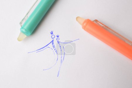 Photo for Letters written on sheet of paper with erasable pens, top view - Royalty Free Image