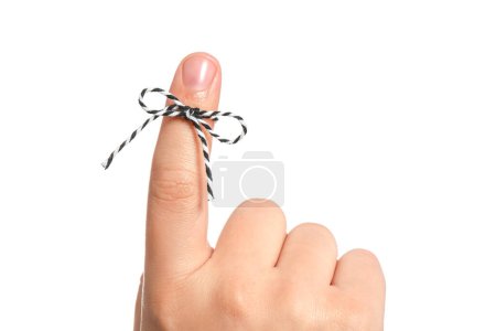 Photo for Man showing index finger with tied striped bow as reminder on white background, closeup - Royalty Free Image